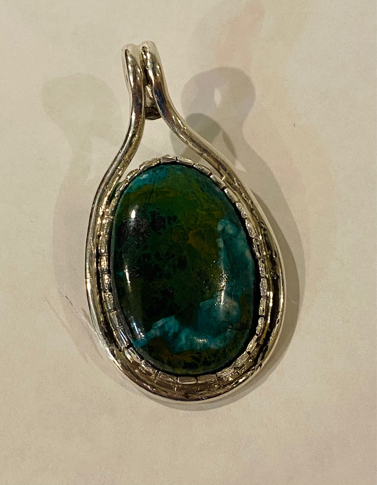  A simple pendant with castellated bezel. 