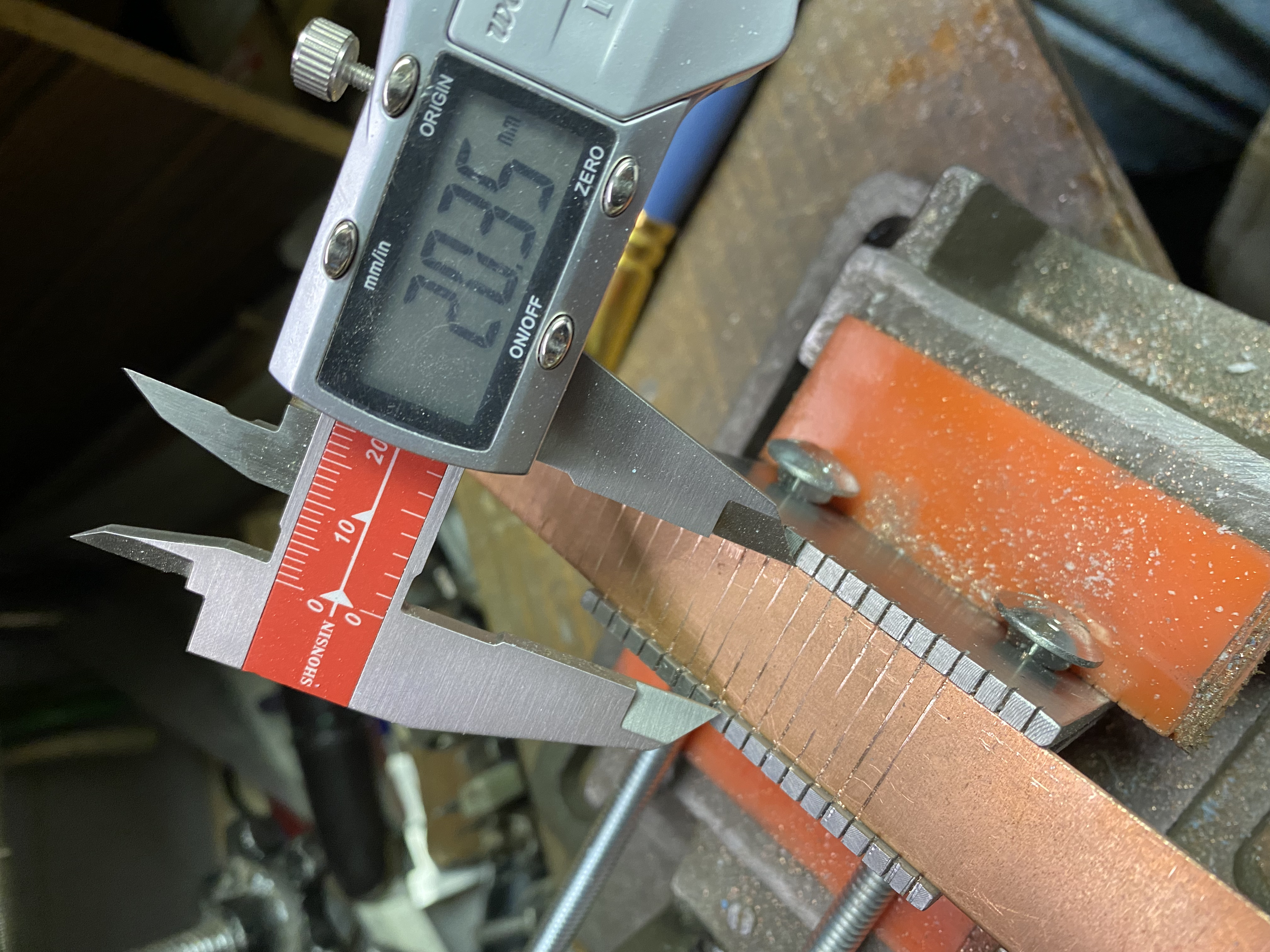  To accommodate the wider material, the standard bolts were replaced with longer ones purchased at a hardware store. 